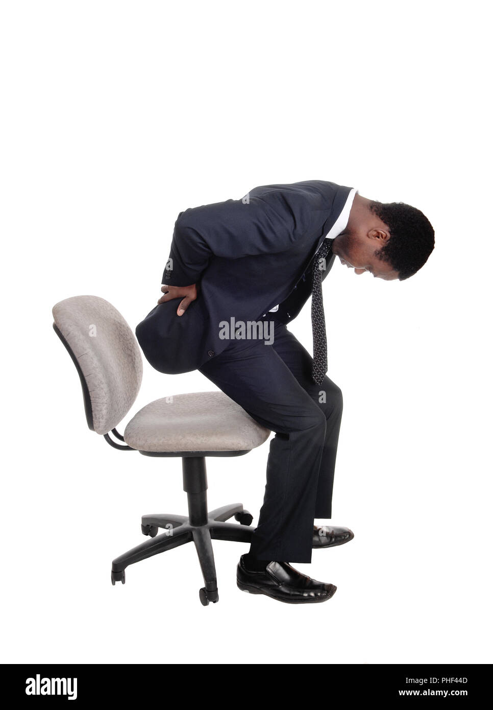 man-with-back-pain-getting-up-from-chair-PHF44D.jpg