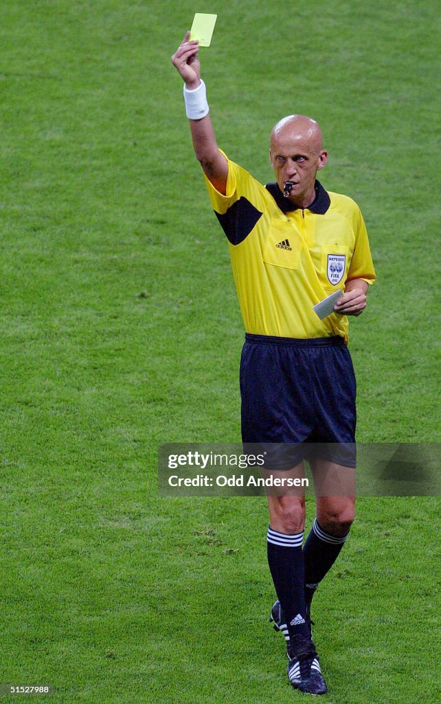 italian-referee-pierluigi-collina-gives-a-yellow-c.jpg